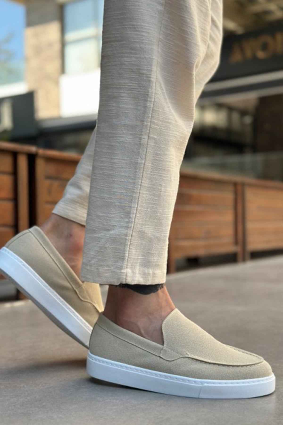 Light beige suede loafers, front-left angle, slip-on style with low white rubber sole